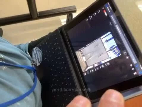 What is man watching? by person