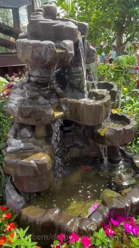 Fountain in the butterfly gardens by derpypandemonium